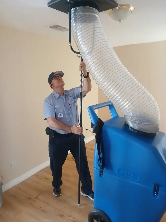 Furnace Tune-Up technician using HEPA equipment in Hazle